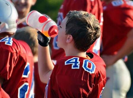 organize sports teams - football player hydrating